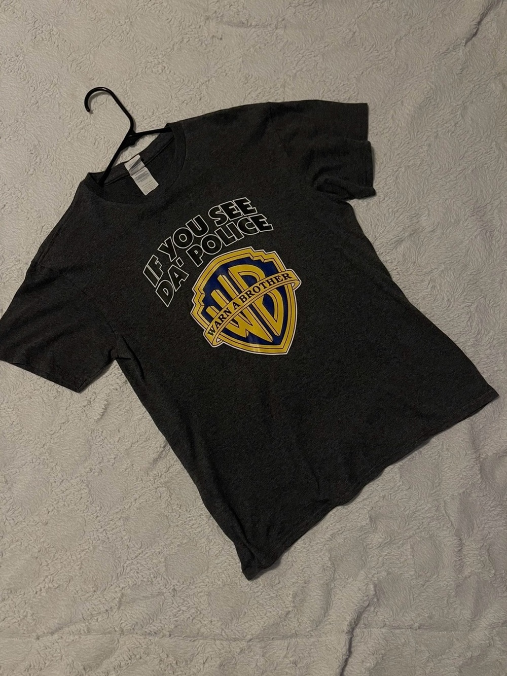 Warner Bros. Black Tee with Yellow & Blue Shield Graphic